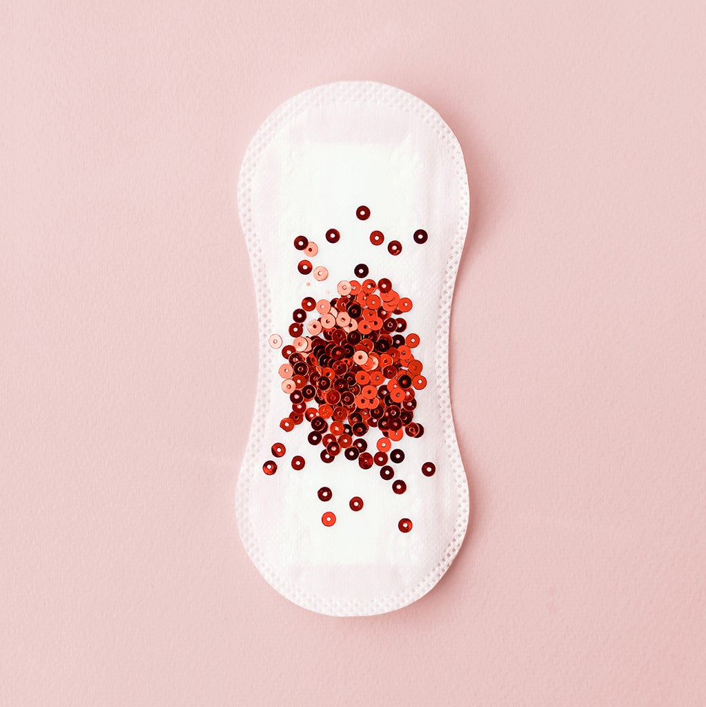 Pad with glitter period on peach background